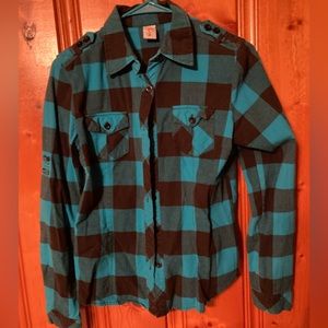 Size says Medium but fits like a small Women’s flannel shirt “Honey Bun”